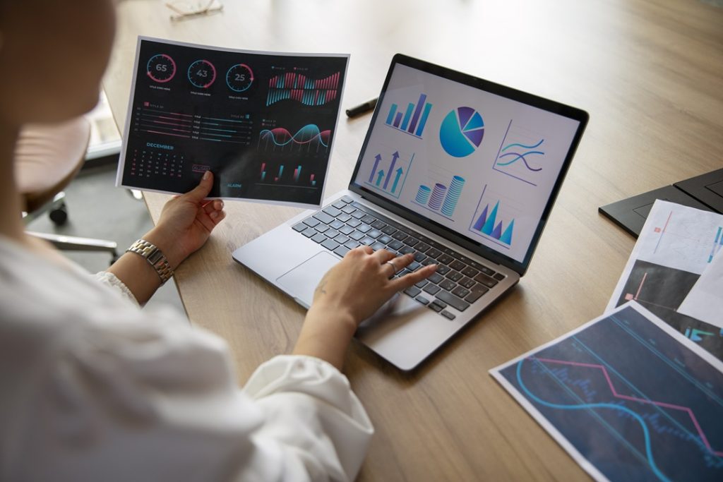 Office Workers Checking And Tracking SEO Metrics To Measure SEO Success